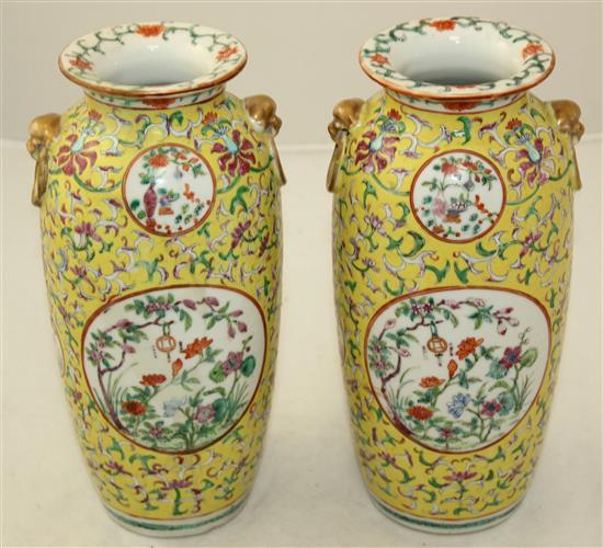 A pair of Chinese yellow ground famille rose vases, Jiaqing marks, early 20th century, 23cm